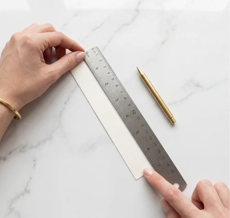 Measure marked string length with ruler in millimeters